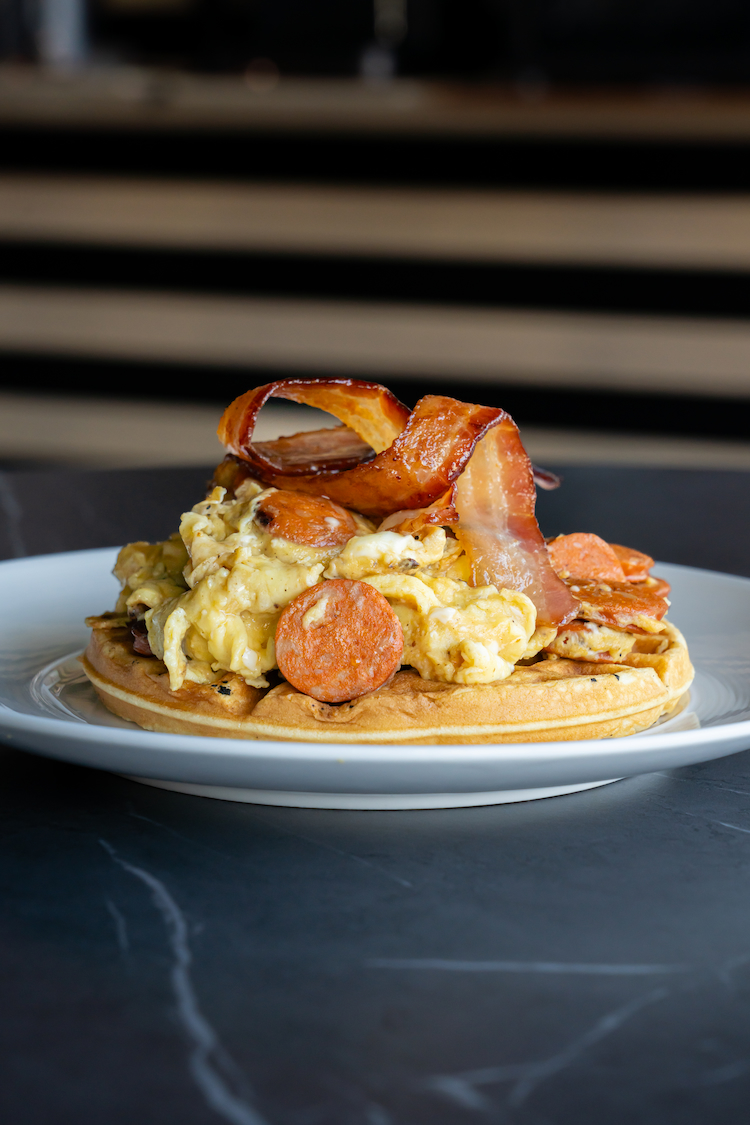 CoCreate CoBrew waffle with scrambled eggs and bacon